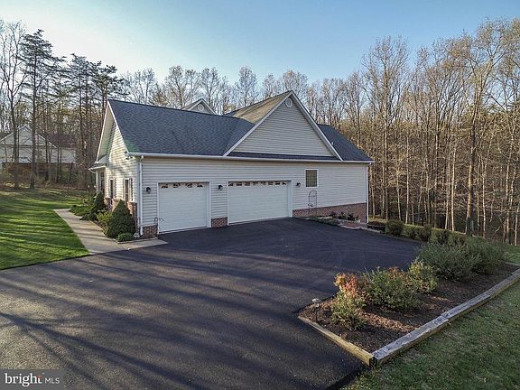 3 car side loading garage; newly sealed driveway