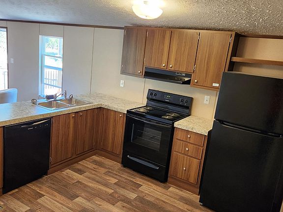 Kitchen area, dishwasher, range, and fridge are all brand new and have a 7-year warranty.
