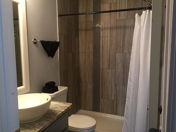 Hall bath was updated to pedestal sink and larger tiled shower