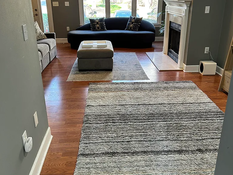 View from kitchen to front door and entry level living room.