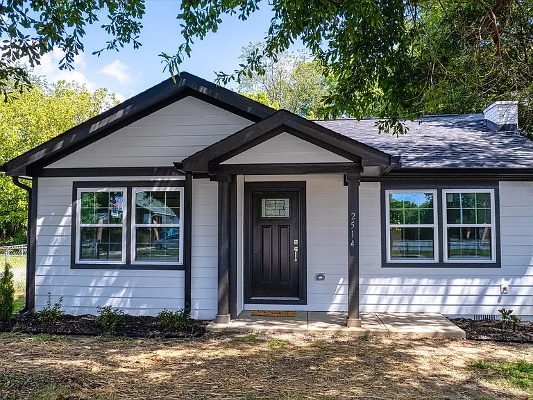 Newly upgraded house well-equipped kitchen with a refrigerator, microwave, dishwasher, and electric range, making meal prep a breeze