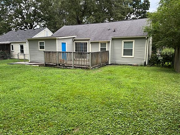 Laundry and dining connect to 16'x16' wooden deck and large yard.
