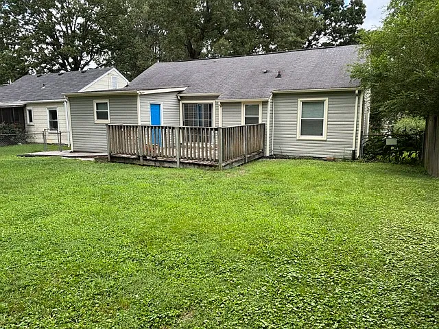 Laundry and dining connect to 16'x16' wooden deck and large yard.