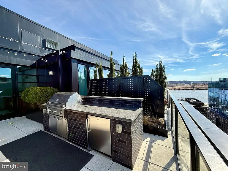 Rooftop terrace with premium grilling station and lounge