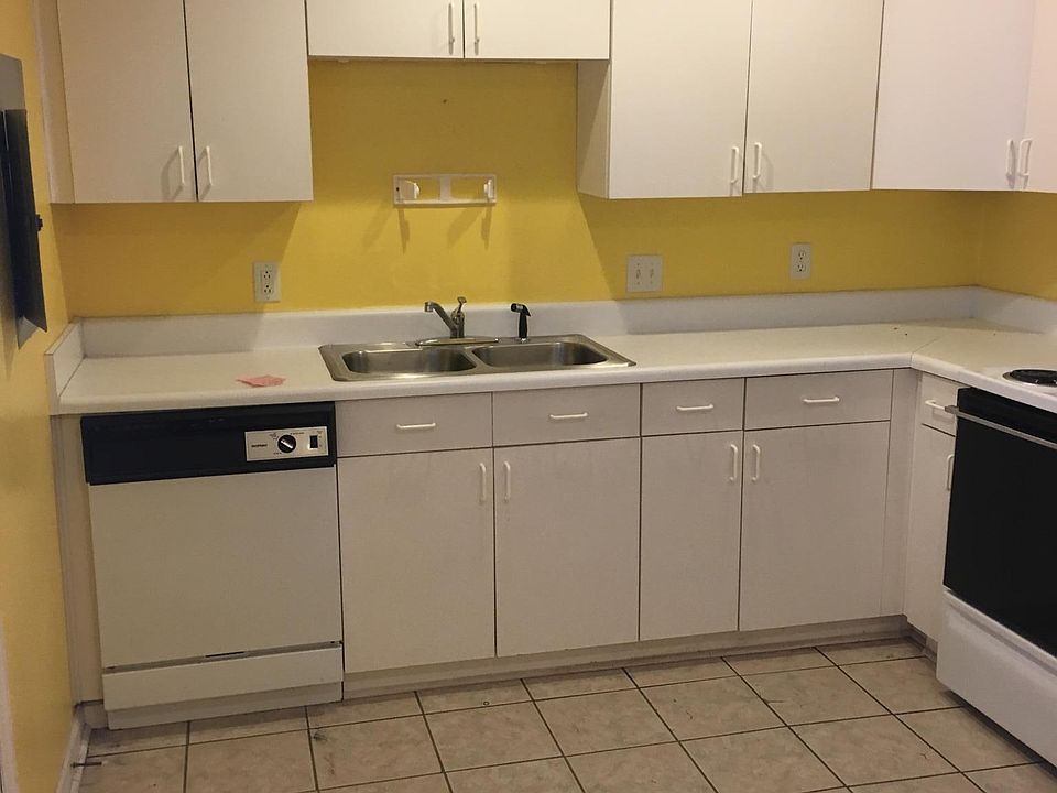 Kitchen Double Sink, Dish Washer, Wall Cabinets, Counter and Electric Range, Washer Dryer added