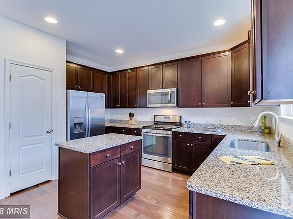 Upgraded Kitchen Cabinets, Oak Wood Floors
