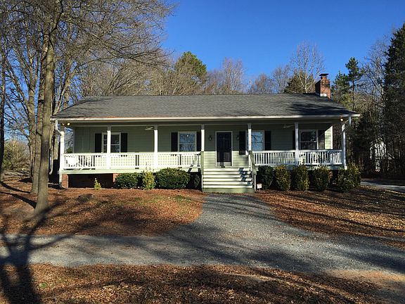 Front view. Awesome front porch with swings