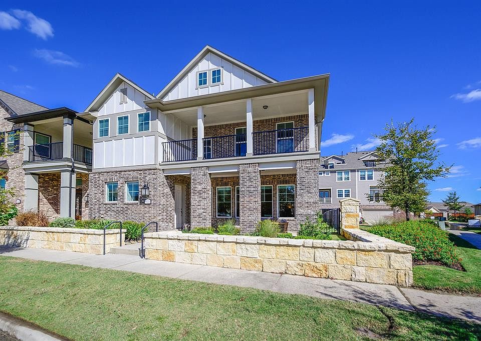 Beautiful Ashton Woods home in the popular Lakeshore section of Towne Lake. The elevation is upgraded to include the balcony.