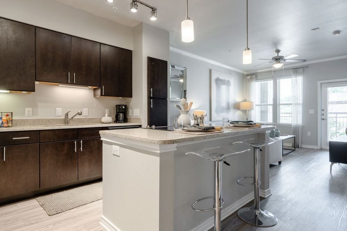 Kitchen and living room with hard surface flooring