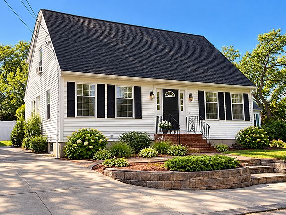 Welcome home! Beautiful Cape-style residence with updated landscaping, new windows and doors, and charming curb appeal.