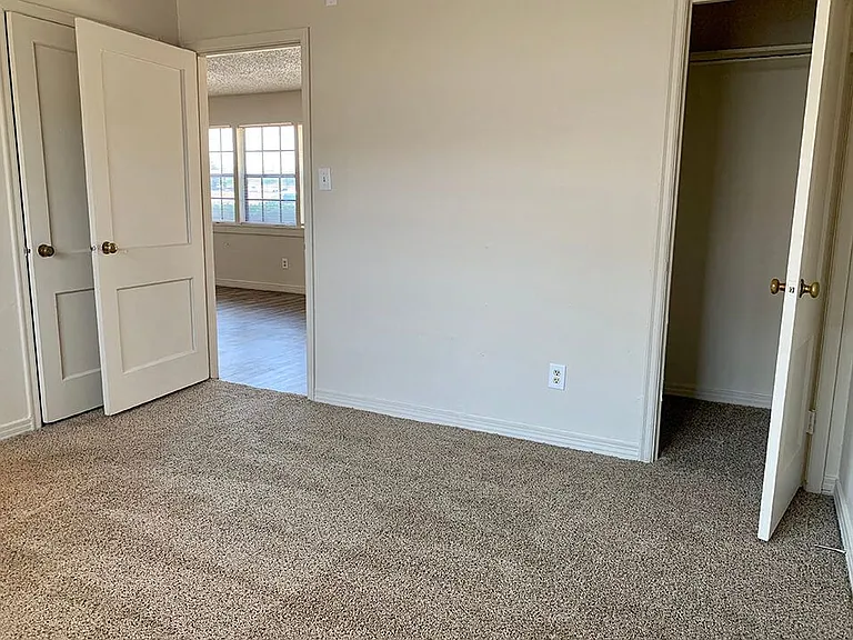 Carpeted Bedroom with Closet
