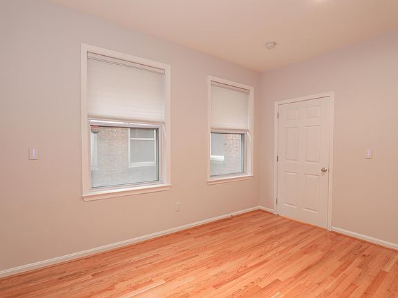 Spacious Bedroom with Hardwood Floors