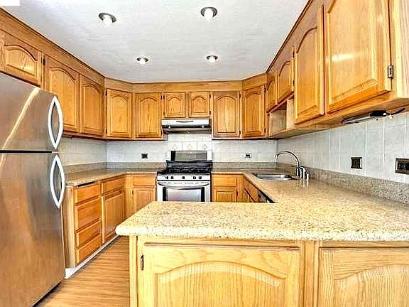 Updated Kitchen with Granite countertops and Stainless Steel Appliances. Gas Stove, Dishwasher, Deep sink