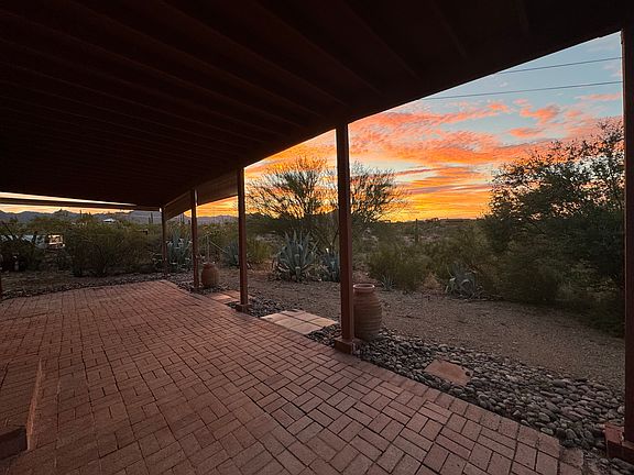 Oversized, covered patio with pull down shades.