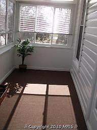 Enclosed porch with ceiling fans