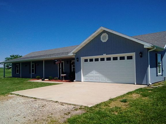 313 SW 1451 Road : 2 Car garage with an insulated door, Lift Master Power opener and new springs.