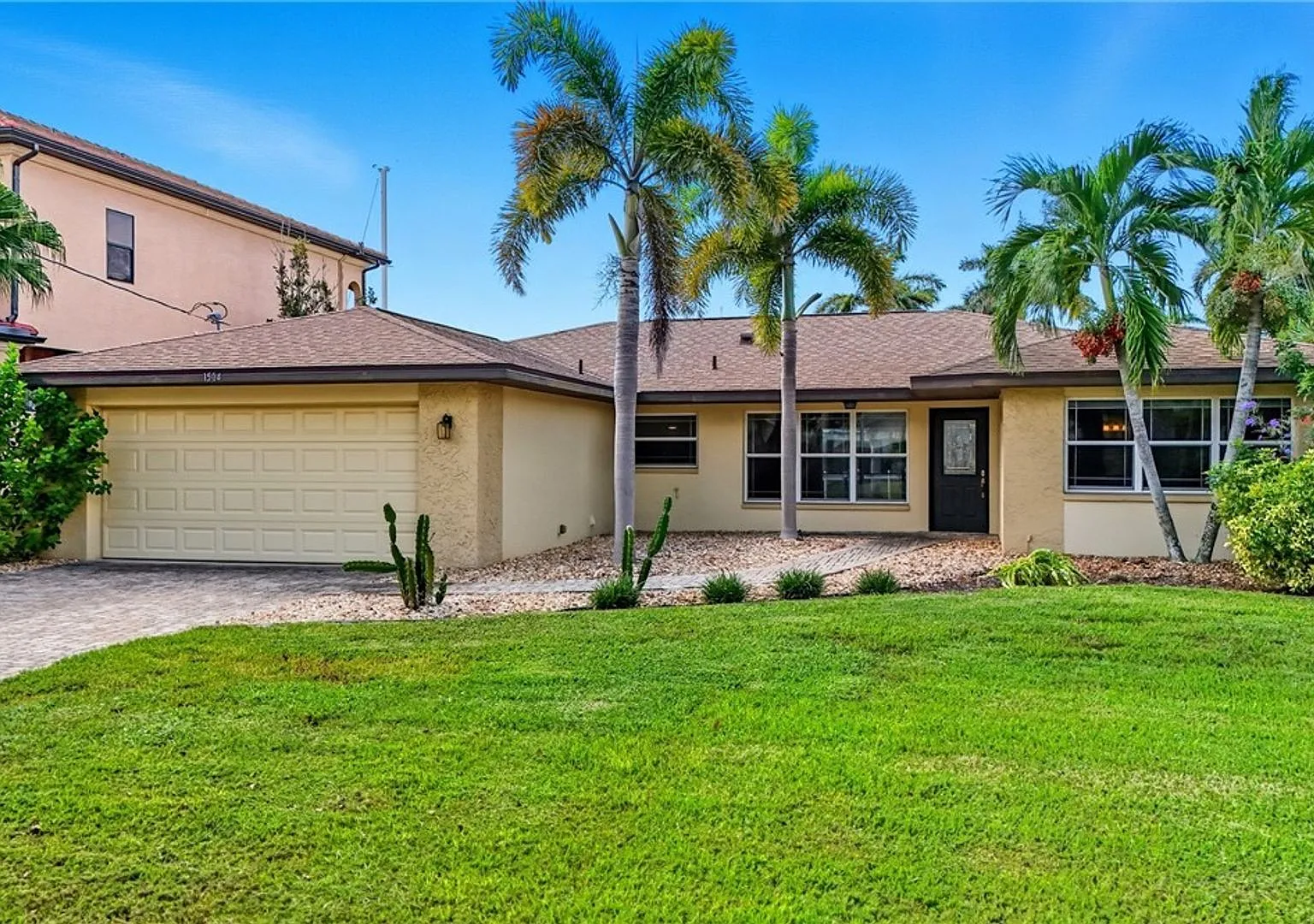 3BR/2BA Cape Coral Waterfront Home with Private Pool, Boat Lifts & 2-Car Garage $2,800/mo — Photo 1