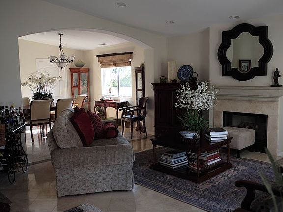 Formal living room with fireplace.