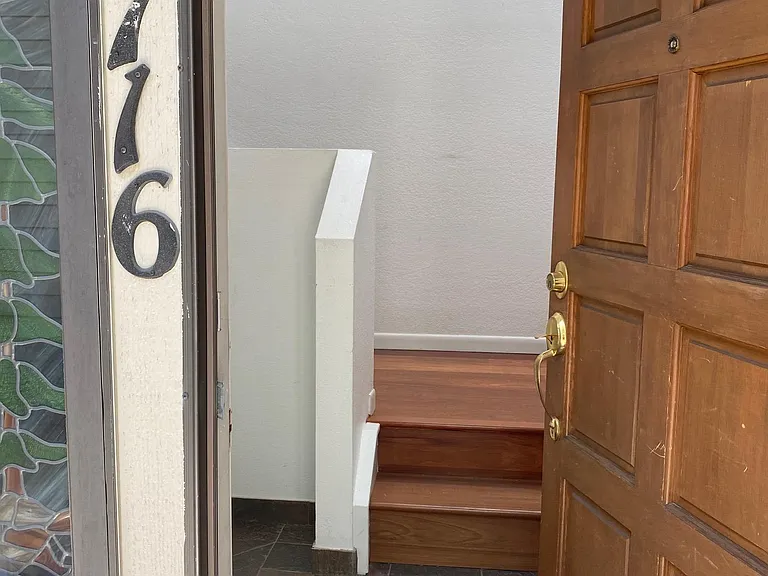 Private entry with cloak closet and door to garage