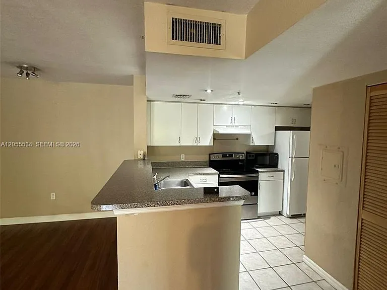 5035 Wiles Rd #203 — Photo 21