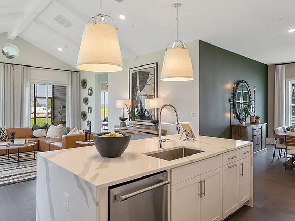 Kitchen with vaulted ceiling and painted ceiling beams