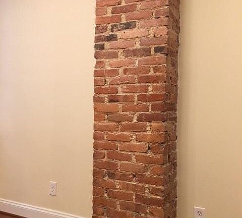 Exposed brick chimney