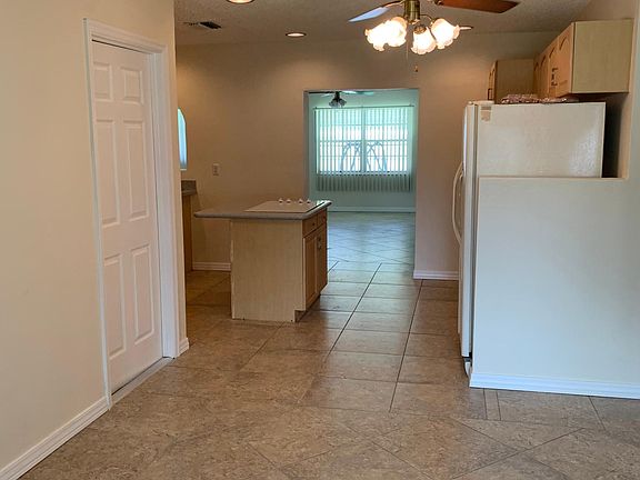 Dining area into kitchen then bonus room.