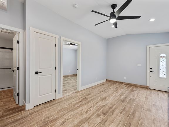 View of living room, bathroom and bedroom. Everything is new. Built in 2025.