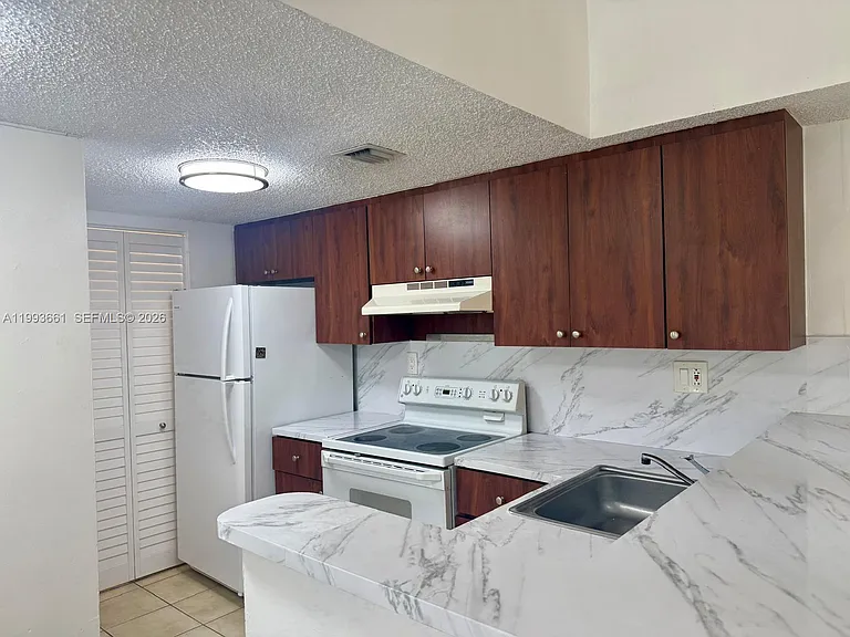 7595 NW 179th St #119 — Photo 9