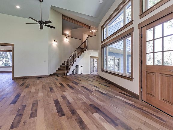 Great room with curved stair to 2nd floor bedrooms