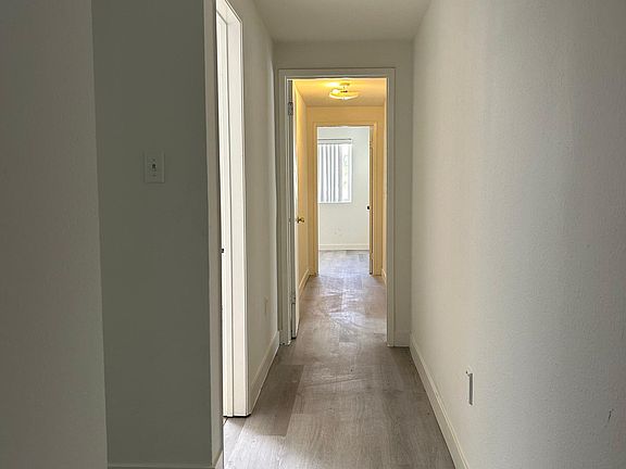 Hallway w/bathrooms and bedrooms