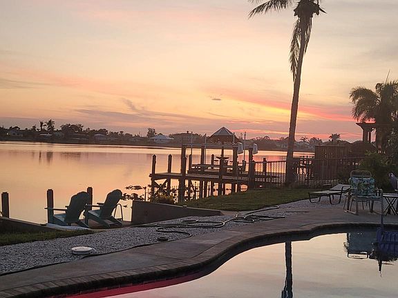 Sunrise photo over pool and Lake Saratoga