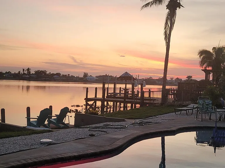 Sunrise photo over pool and Lake Saratoga