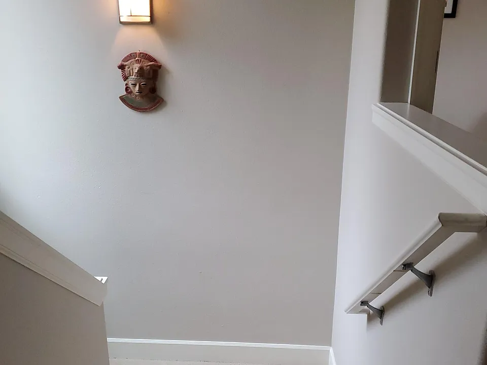 Stairs to the open bedroom