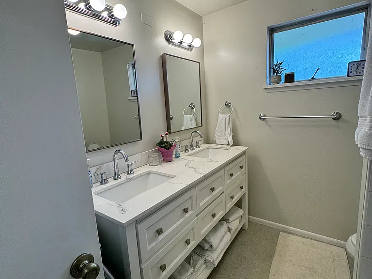 Full Bathroom on the main floor, great updates to vanities, sinks, fixtures and bathtub/shower