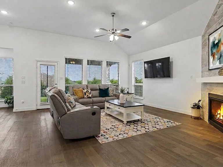 Plenty of space in this family room plus a gas log fireplace operated by a switch for easy lighting in the winter.