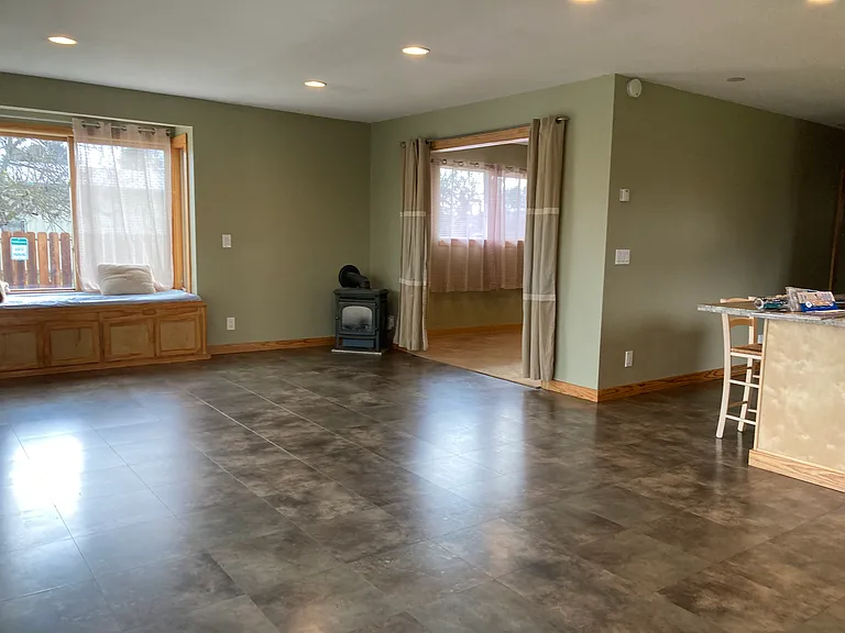 Living room with the gas heater which has flames for charm.