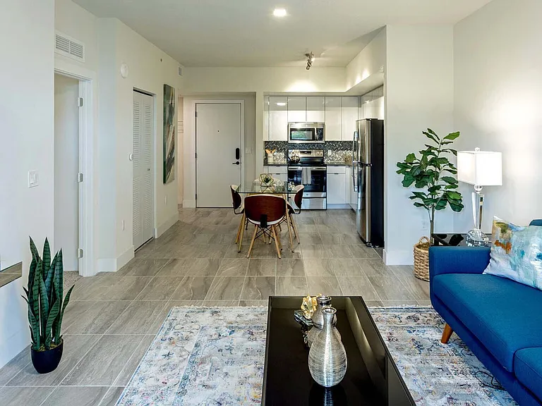 Griffis Pompano Beach apartment living room with wood style floor.