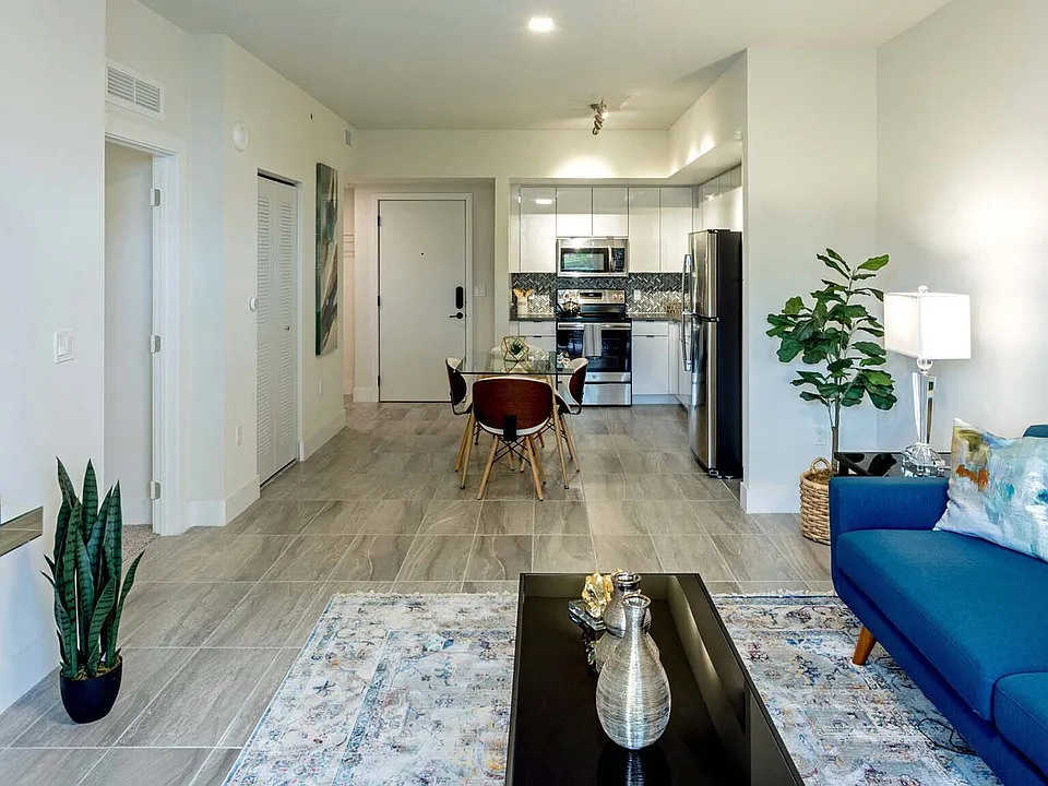 Griffis Pompano Beach apartment living room with wood style floor.