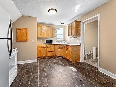 Photo of dining room looking into the kitchen