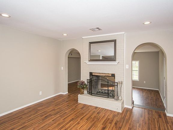 Charming arched walkways and a double sided, wood burning fi