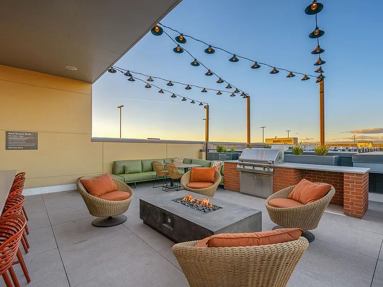 Rooftop lounge with fire pit and seating