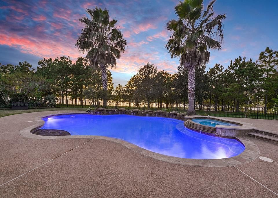 Take a dip in your own backyard paradise or relax in the spa.The beautifully landscaped space features a gorgeous view.
