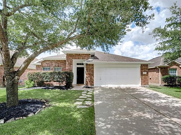 Delightful 1-story home nestled in the heart of Westheimer Lakes featuring pretty brick elevation and double garage.