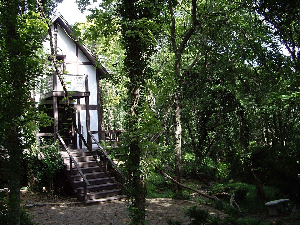 stairs leading to wrap around deck full length of house