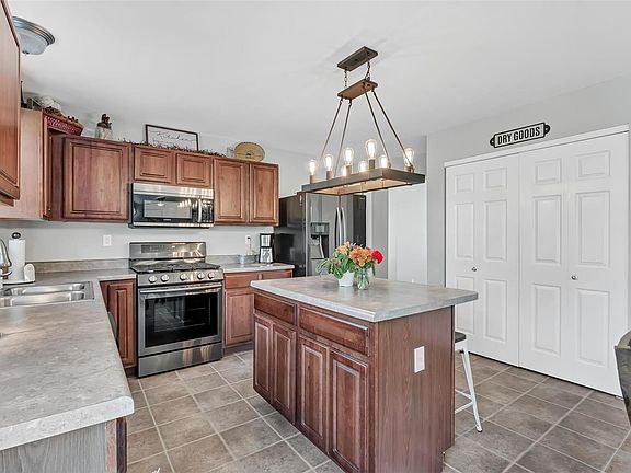 Beautiful Cherry cabinets and upgraded lighting in the kitchen