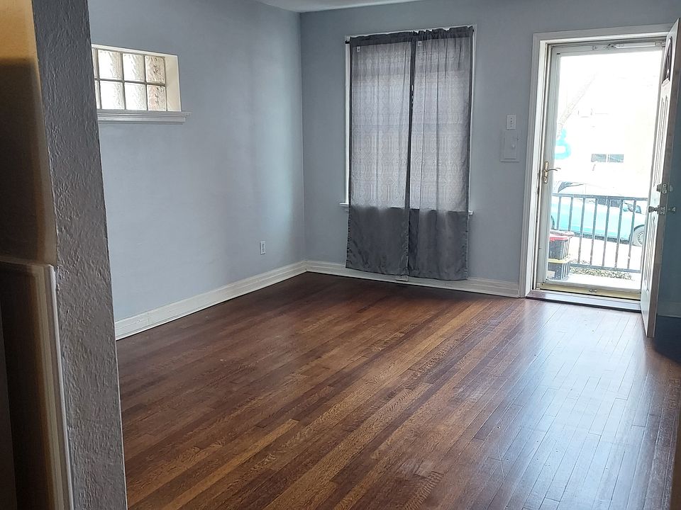 Entry from front porch to Living room with plenty of natural light. And Hardwood floors.