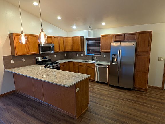 Kitchen- granite countertops, bar, newer stainless steel appliances