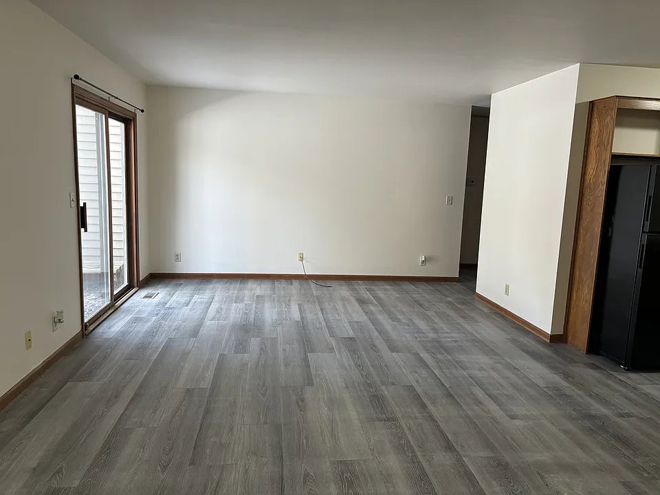 Large living/dining area off kitchen with slider to side yard.