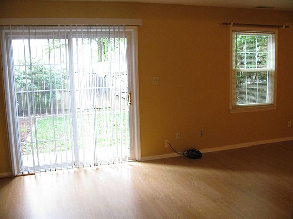 Large Living room area w/ window and sliding New sliding glass door